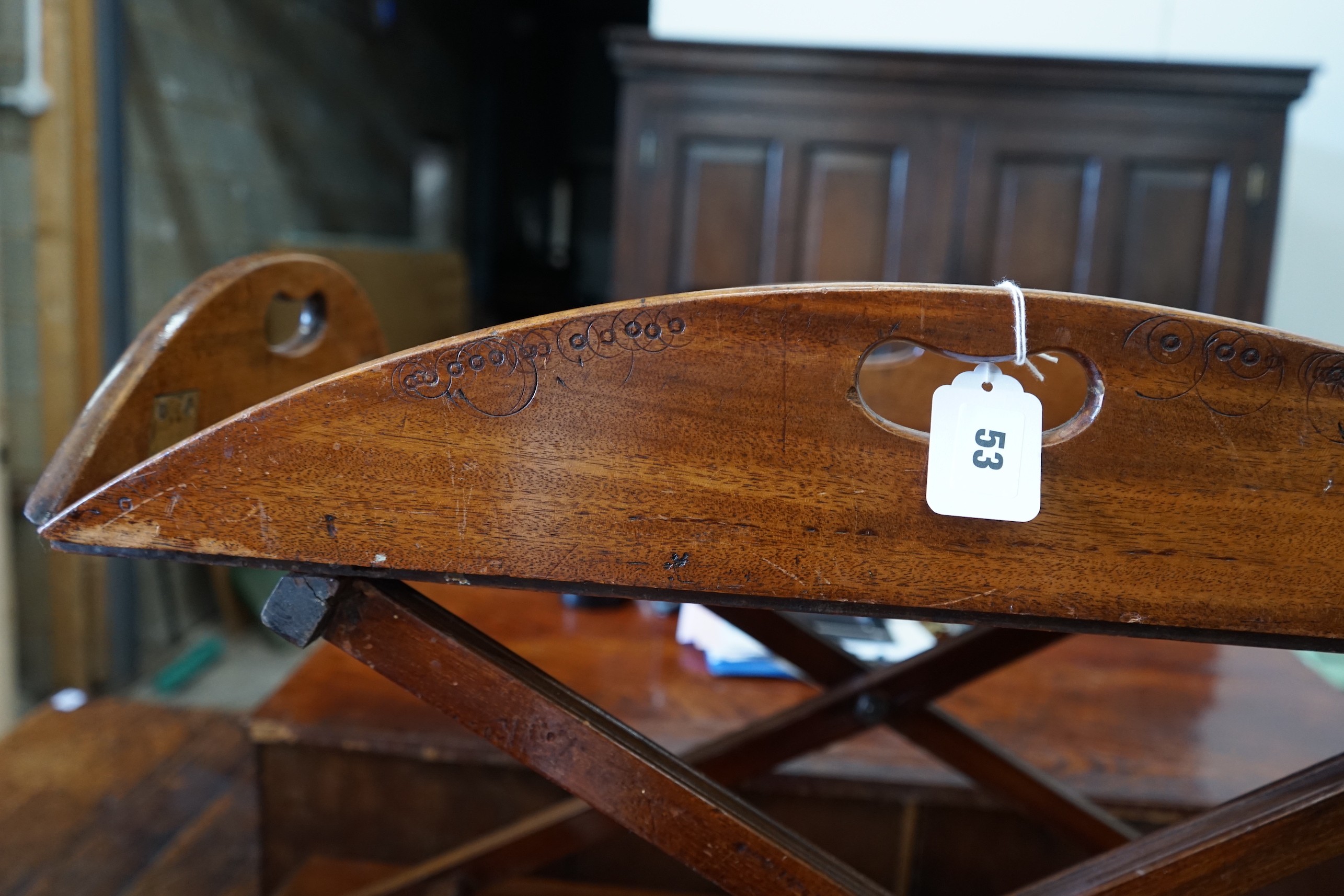 A Victorian mahogany folding butler’s tray, width 91cm, depth 63cm, height 41cm on later stand